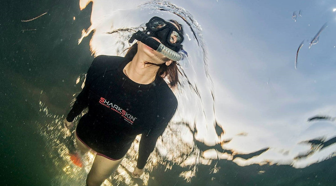 Female Snorkelling wearing a Sharkskin top 